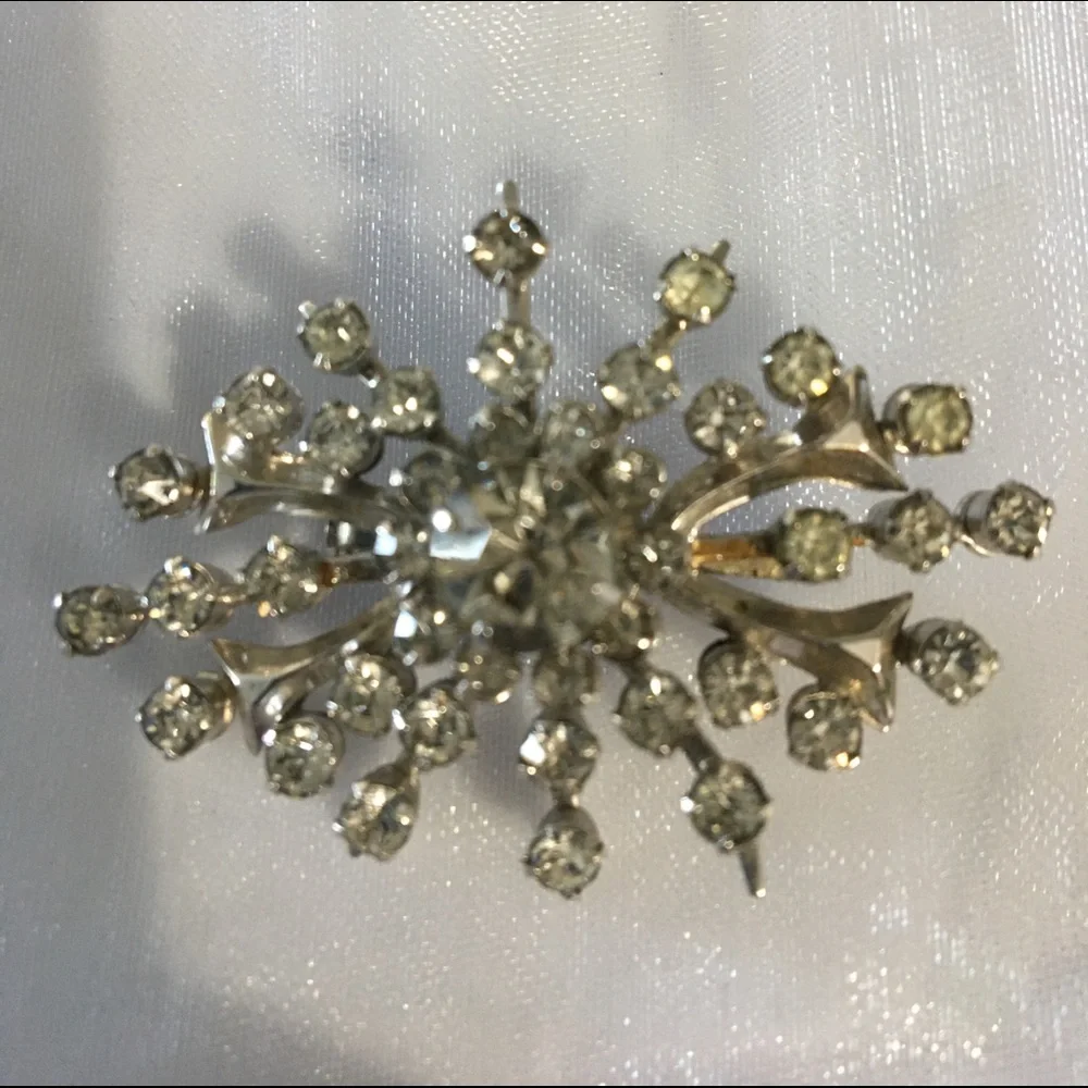 Vintage riveted clear rhinestone brooch